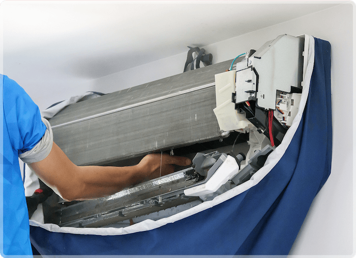 Technician installing HVAC