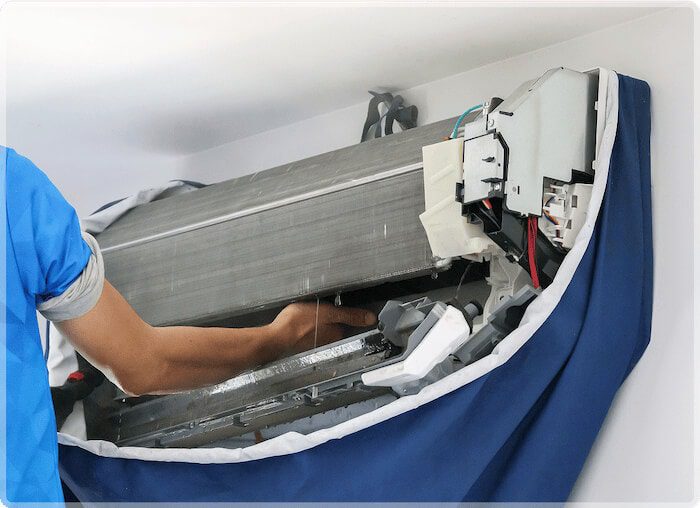 Technician installing HVAC