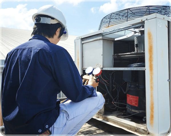 Technician checking furnace