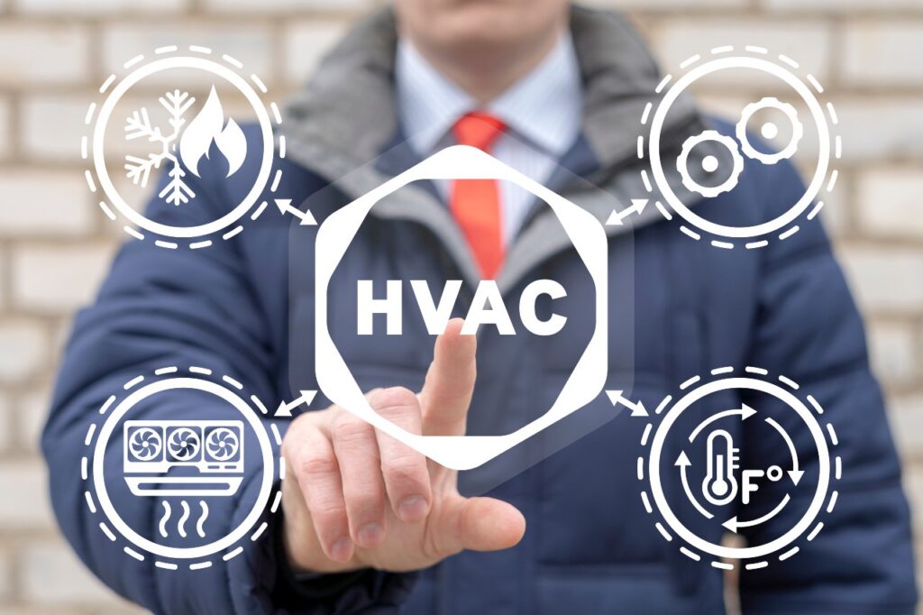 A person in a suit touches a virtual interface displaying "HVAC" surrounded by icons for cooling, heating, ventilation, and temperature control. hvac maintenance plans